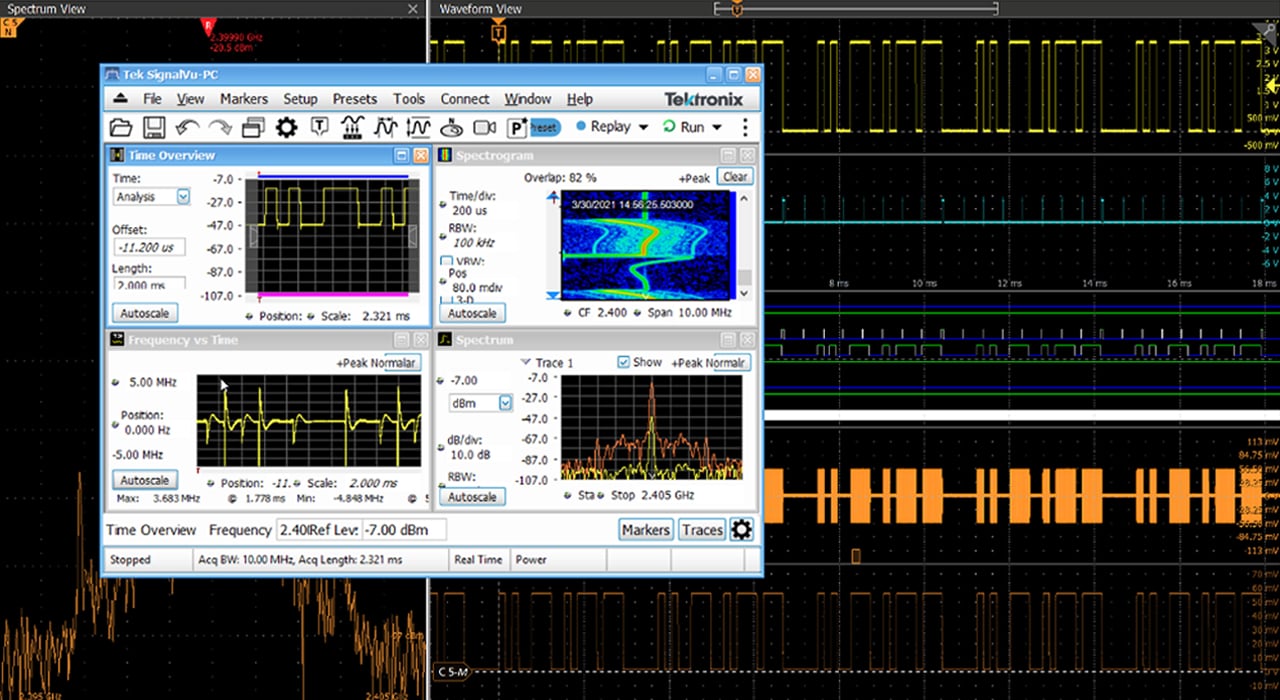 A screenshot of a Tektronix oscilloscope display showing multiple waveform traces and signal measurements in both time and frequency domains