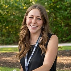 Headshot of a female with curled hair