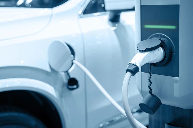 An electric vehicle recharging at an EVSE station
