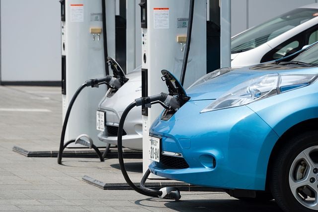 Two Electric Vehicles getting re-charged at an EVSE station