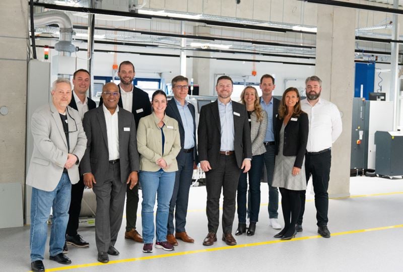 EA Elektro-Automatik and Tektronix executives in EA’s manufacturing facility.