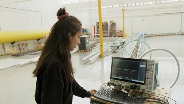 Aanchal Mittal, an engineer at Magway, in the United Kingdom, uses Tektronix solutions to test a carbon-free deliver system.