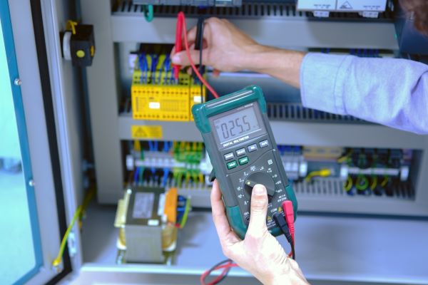 handheld digital multimeter technician measurement