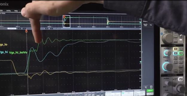 Engineer using a Tektronix Isolated probe with an oscilloscope