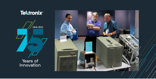 Dave Brown (center) shows vintage Tektronix equipment at the Northwest Electrical Design and Manufacturing Show. 