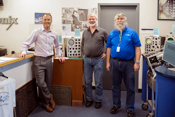 Dave Brown (rigth), president of the vintageTEK museum, welcomes Fluke President Mark Tremblay and Tektronix ASIC Design Fellow Dan Knierim to the vintageTEK Museum.