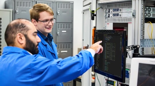 Engineers configuring MP5000 Precision Modular Test System