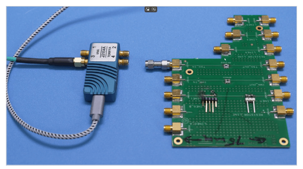 TDR probe connected to a PCB test fixture for impedance and signal integrity measurements.