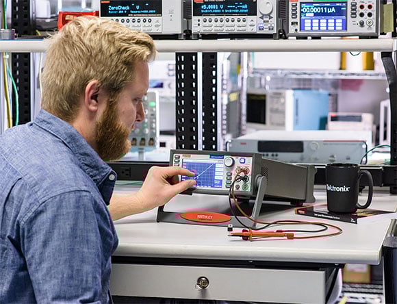 Man Working on I-V Curve Tracer Software