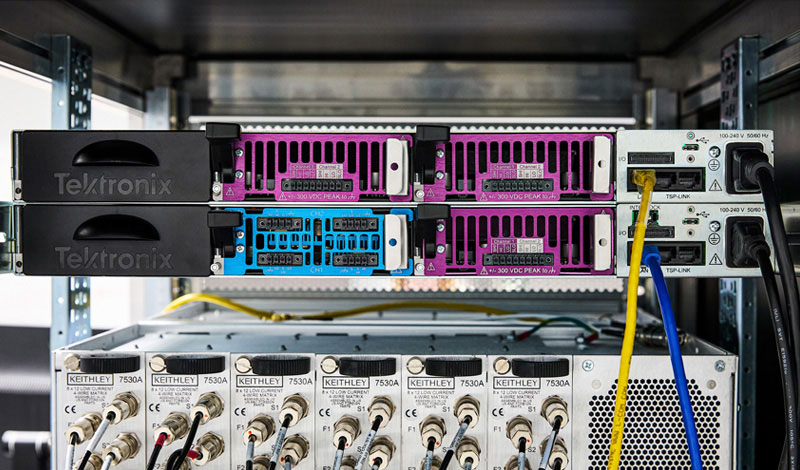 Rear view of Tektronix MP5000 Series rack: high-density modular test system with swappable power and measurement modules.