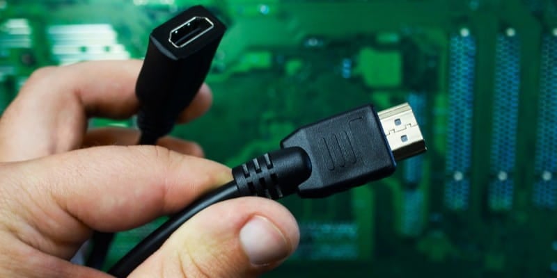 Hand holding HDMI